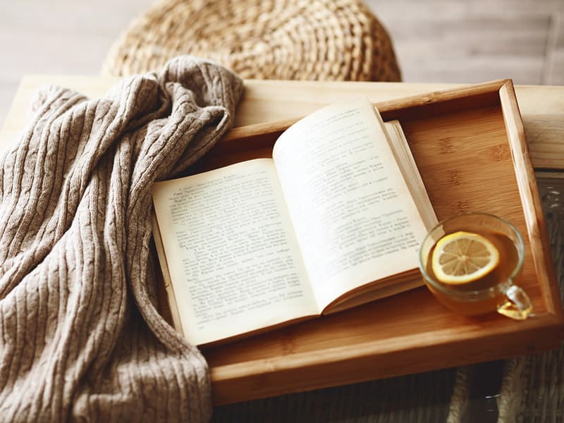 A book and a cup of tea in a guest room